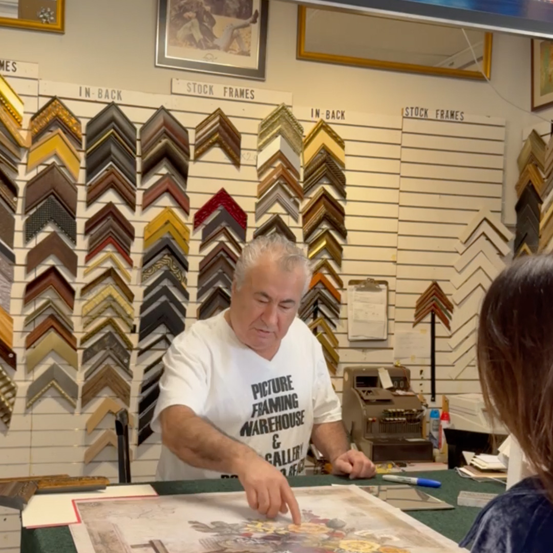 Karl helping a customer choose frames at Picture Framing Warehouse